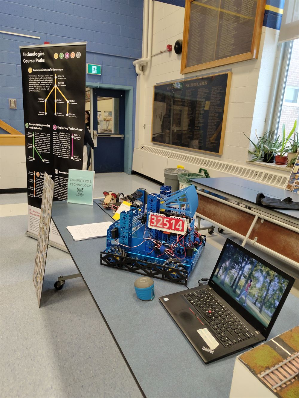 A WLMAC robot on the display table at the school course fair